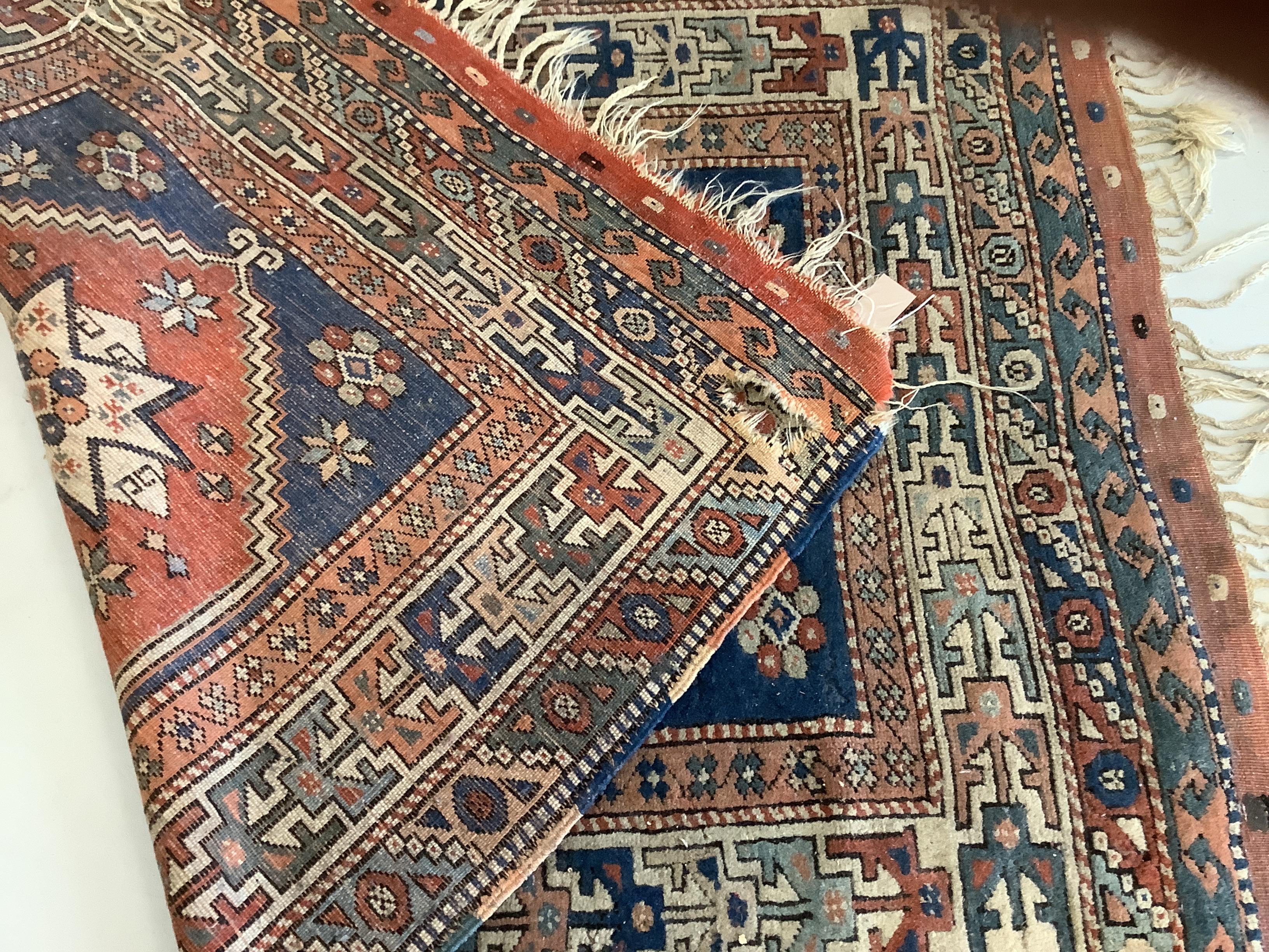 A Caucasian blue ground rug, 150 x 106cm